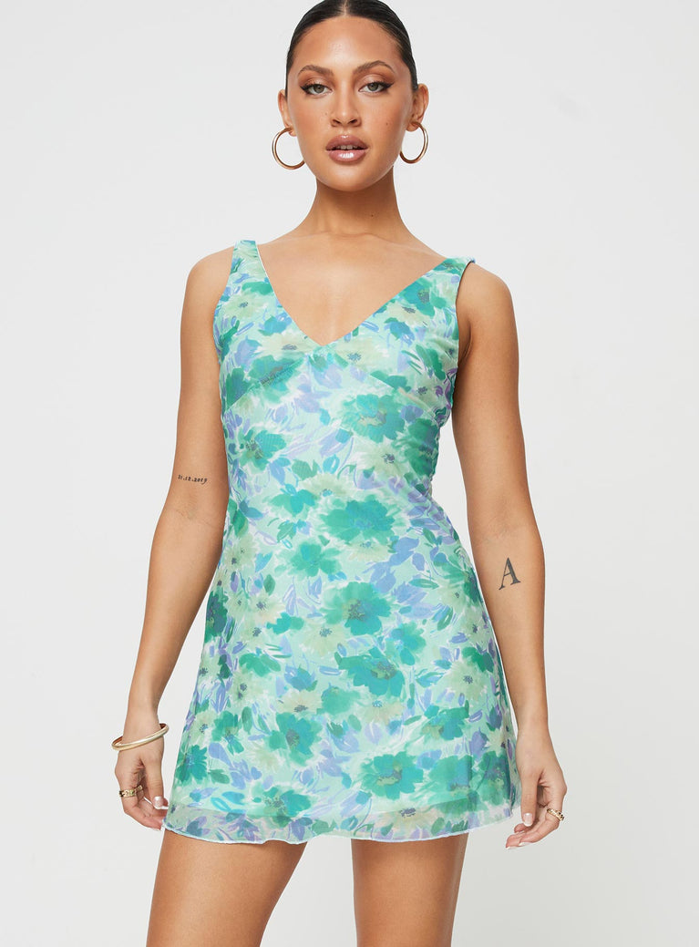 Front view of model wearing  front Princess Polly Crew Neck  Zuba Mini Dress Green Floral