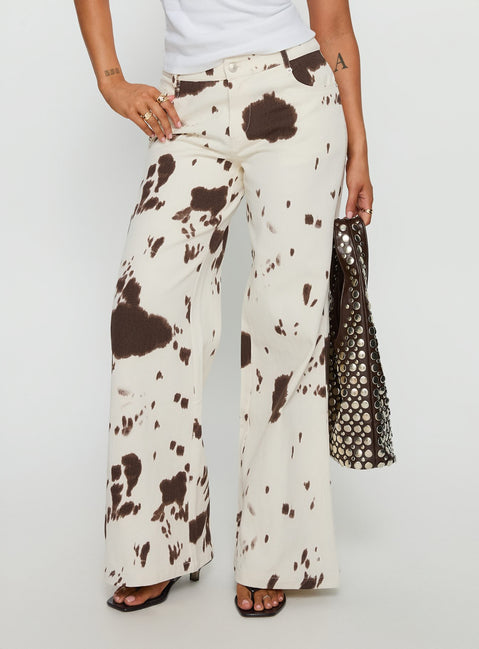 side view of model wearing Princess Polly Big Dreamer Low Rise Straight Leg Jeans Cow Print Low Rise Jeans 