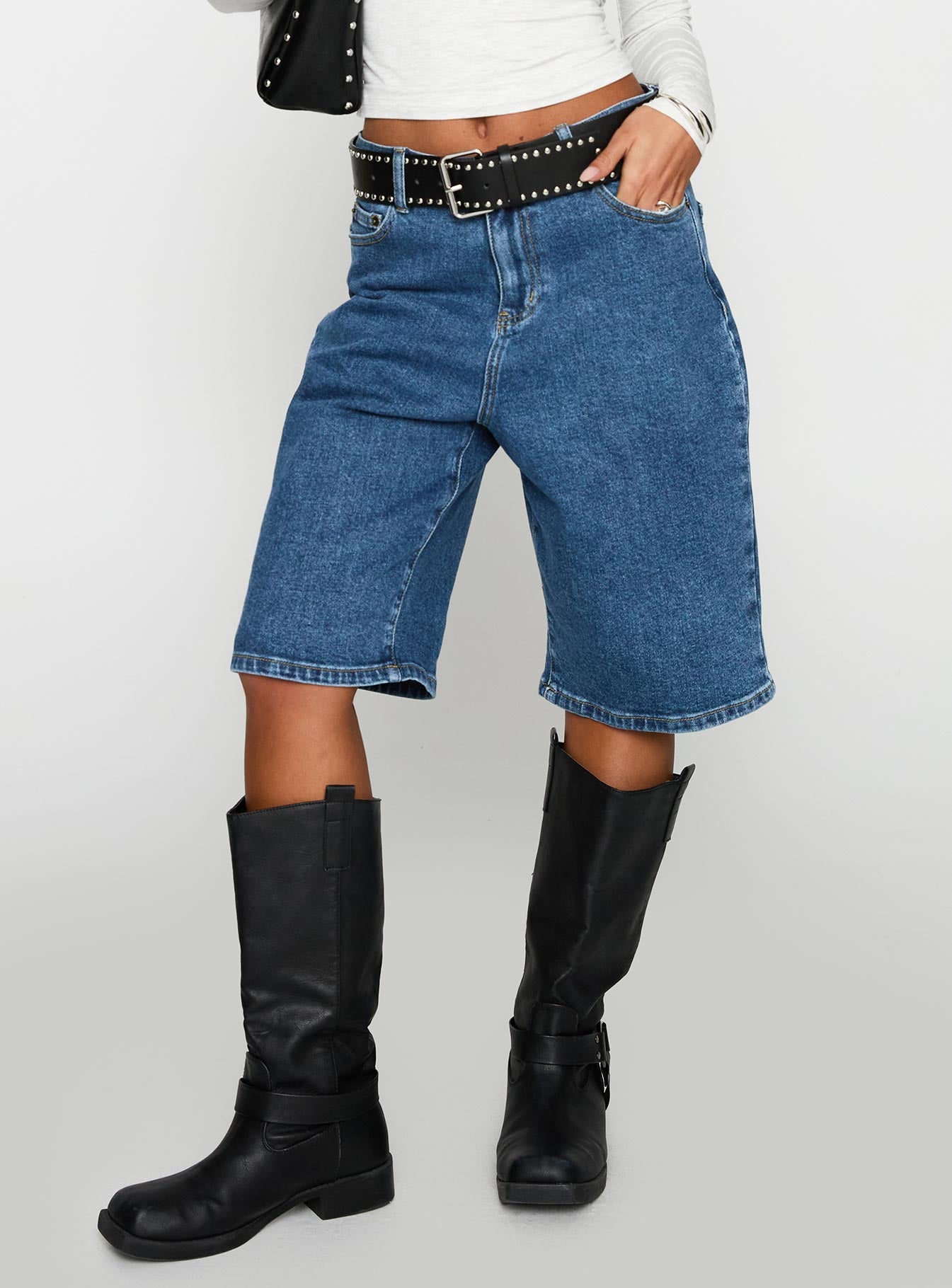 front view of model wearing Princess Polly Retro Dream Mid Rise Longline Denim Shorts Mid Wash Low Rise Shorts 