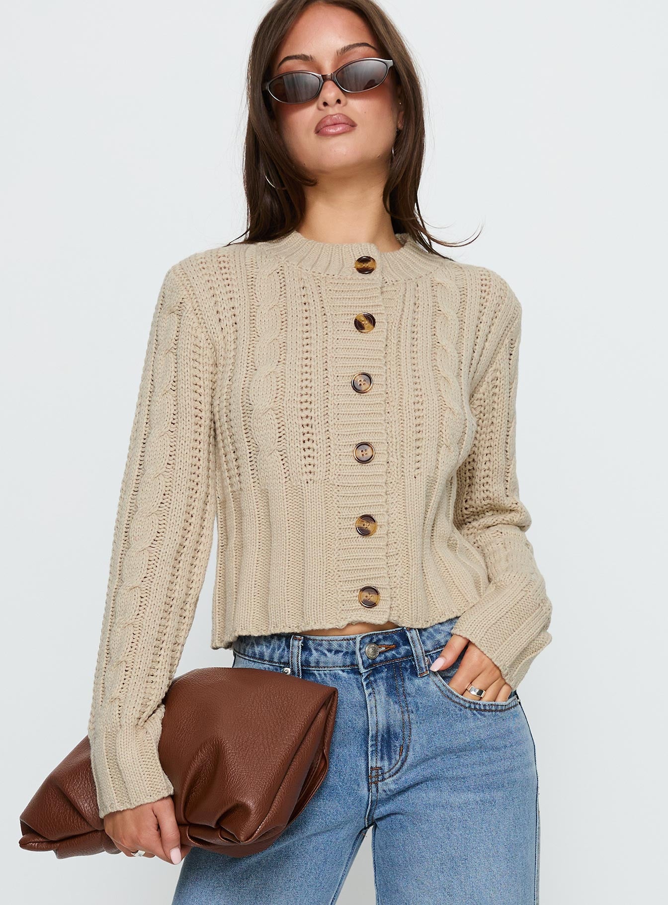 front view of model wearing Princess Polly Donielle Cable Knit Cardigan Beige cropped 