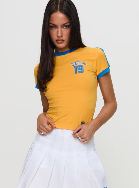 front view of model wearing Princess Polly UCLA Goalie Baby Tee Yellow Short Sleeves Crew Neck 