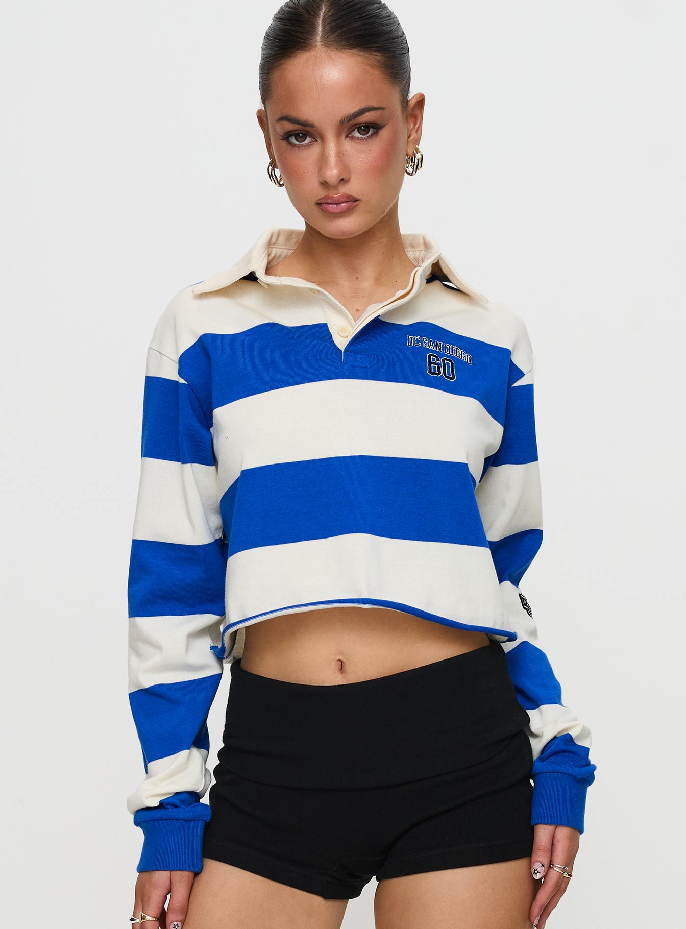 front view of model wearing Princess Polly UCSD Rugby Polo Navy / White Full Sleeves V-Neck 