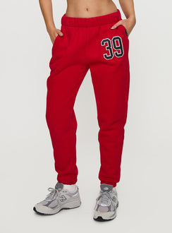 front view of model wearing Princess Polly BU Sweatpants Red High Waisted Pants 