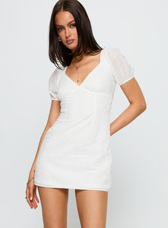side view of model wearing Princess Polly Viella Broiderie Mini Dress White V-Neck 