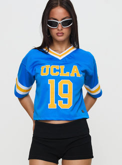 front view of model wearing Princess Polly UCLA Football Jersey Blue Half Sleeves V-Neck 