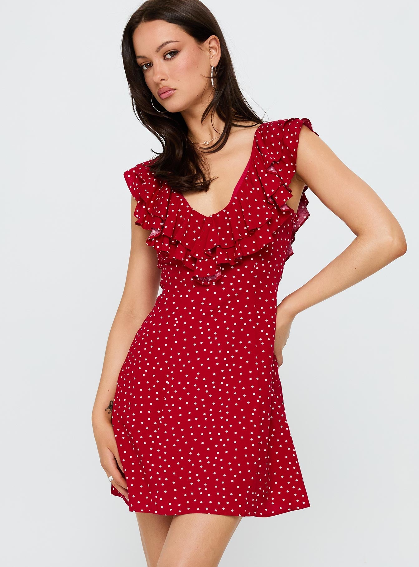 side view of model wearing Princess Polly Cherry Schnapps Flutter Mini Dress Red Polka V-Neck 