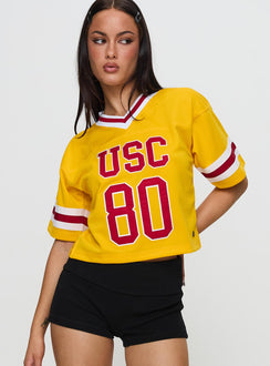 front view of model wearing Princess Polly USC Football Jersey Gold Half Sleeves V-Neck 