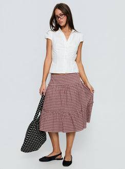   side view of model wearing Princess Polly Cascades Low Rise Midi Skirt Red Check Midi Skirts 