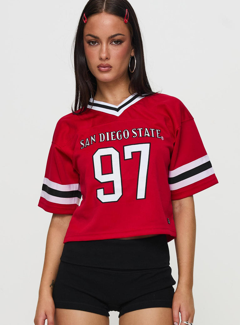 front view of model wearing Princess Polly SDSU Football Jersey Red Half Sleeves V-Neck 