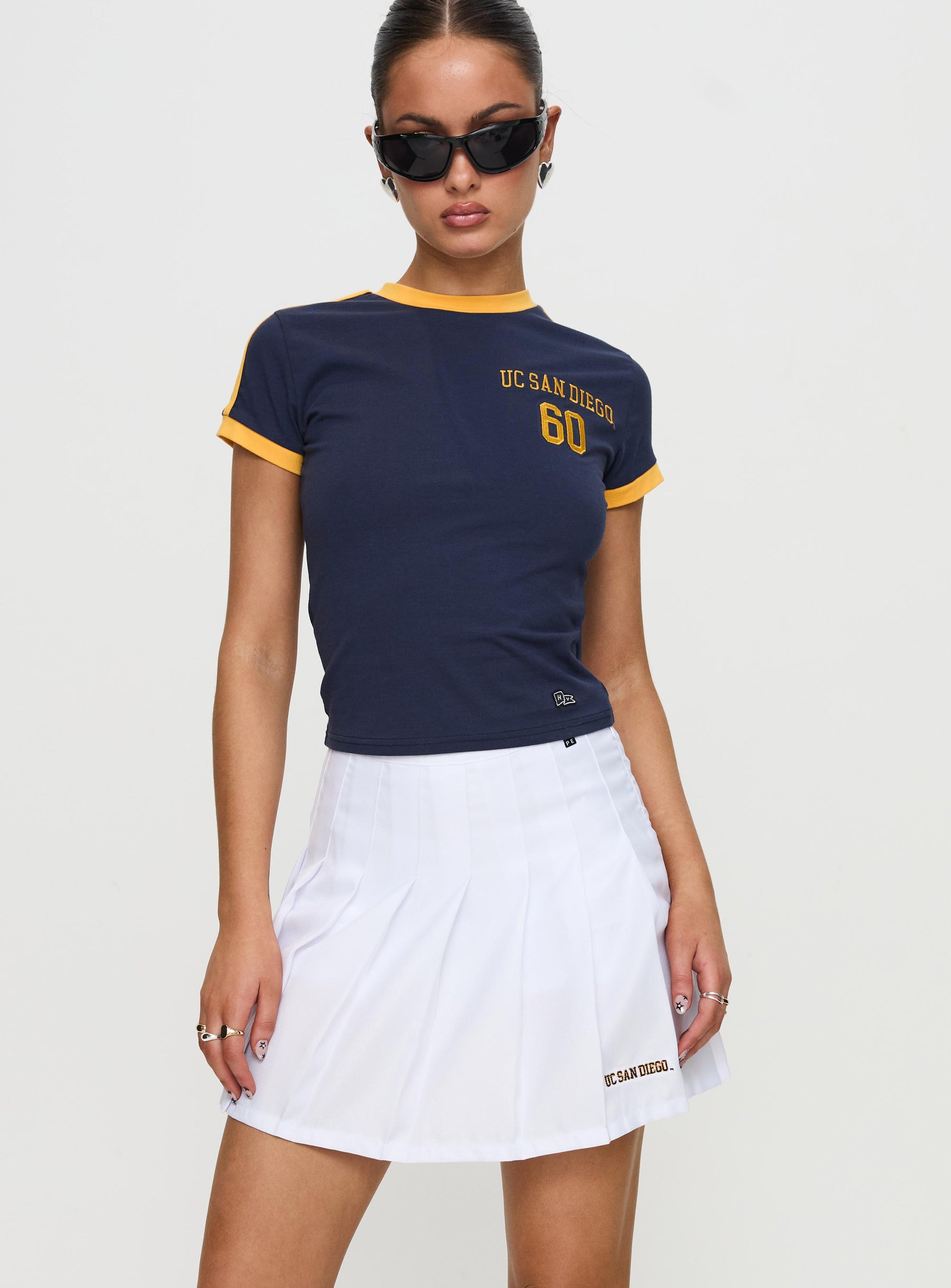   front view of model wearing Princess Polly UCSD Tennis Skort White 