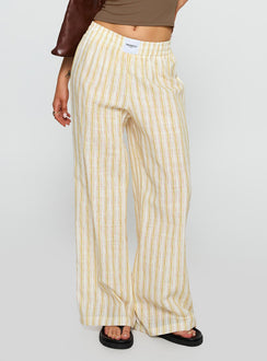 side view of model wearing Princess Polly Beach House Pants Yellow Stripe High Waisted Pants 