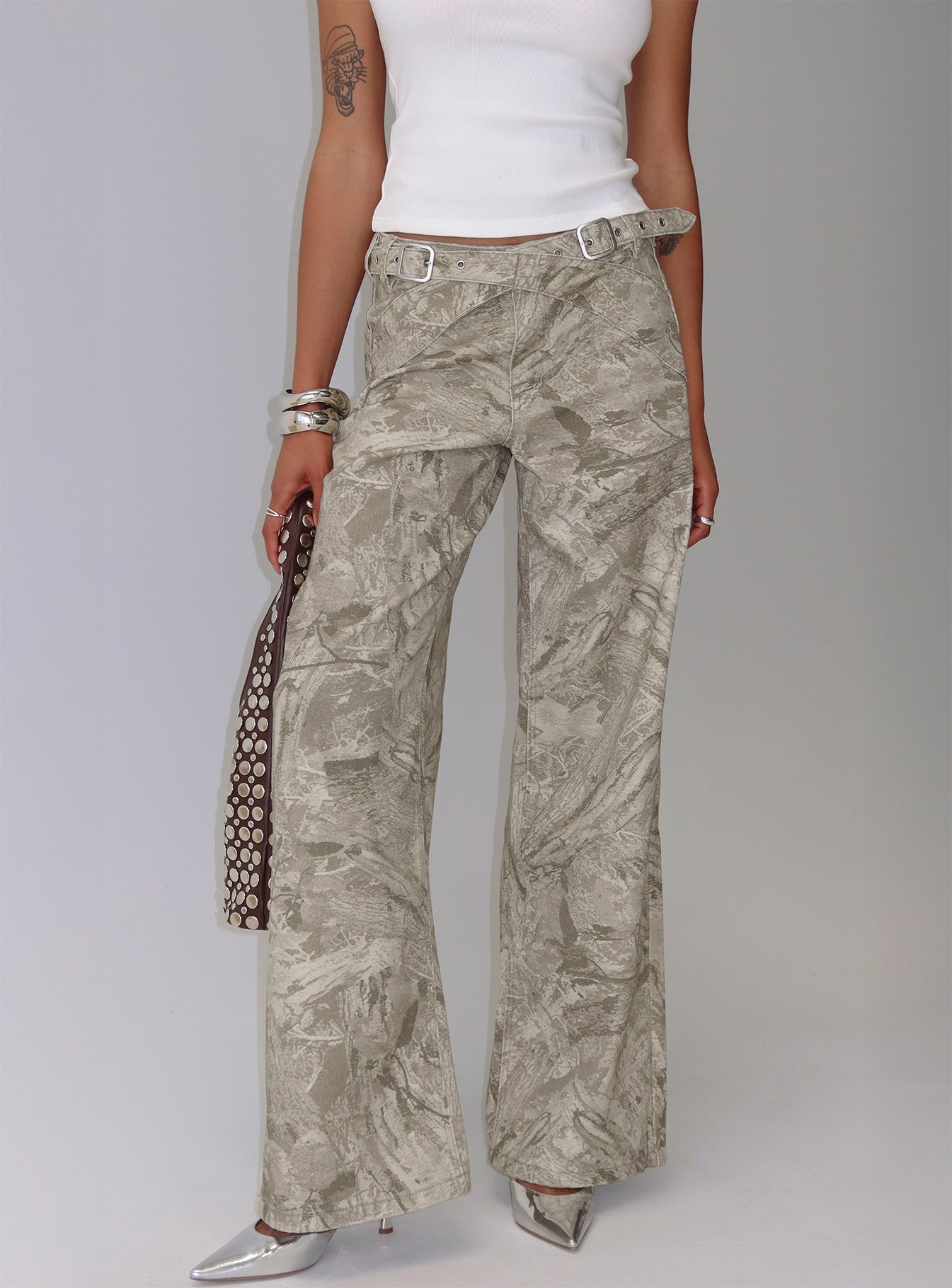 side view of model wearing Princess Polly Mckinley Mid Rise Wide Leg Jeans Camouflage Mid Rise Jeans 