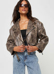 Faux leather cropped jacket Lapel collar, zip front fastening, twin hip pockets, removable buckle belt, belt loops at waist, zip at cuff