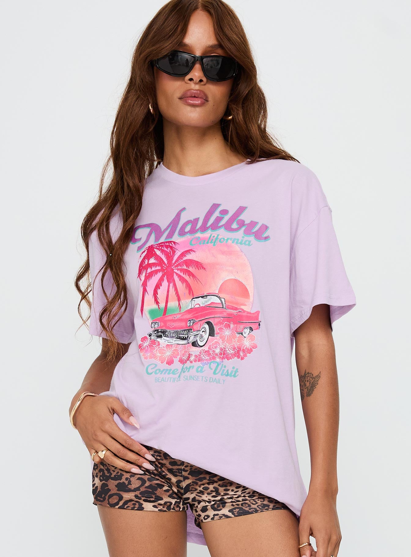 front view of model wearing Princess Polly Malibu Sunset Oversized Graphic Tee Purple Half Sleeves Crew Neck 