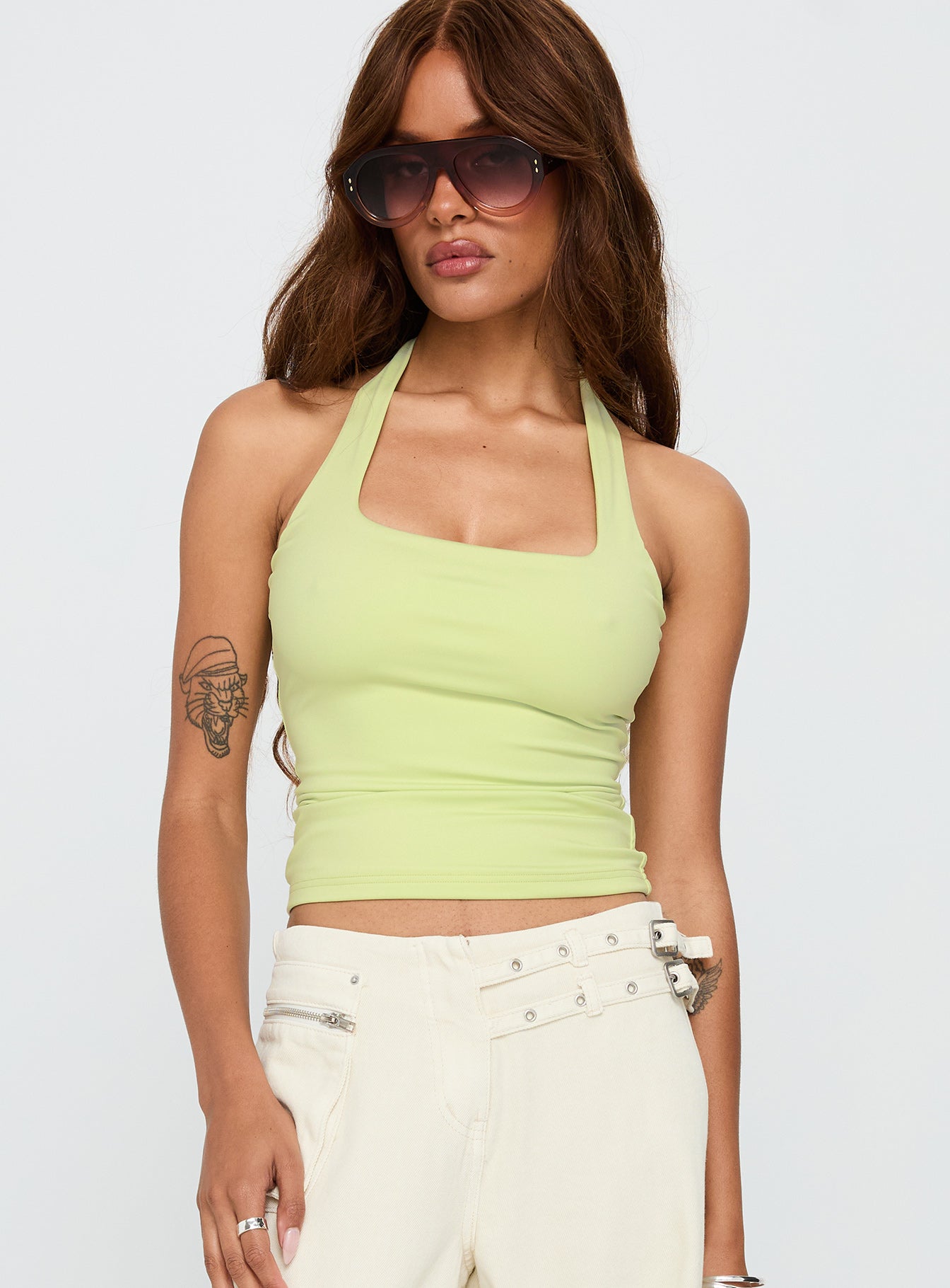 front view of model wearing Princess Polly Assumptions Halter Top Sage Sleeveless Square Neck 