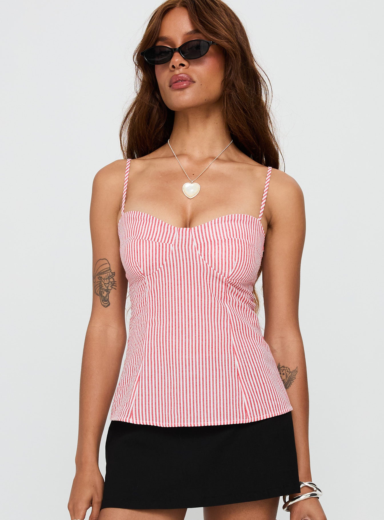 side view of model wearing Princess Polly In Your Palm Top Red Stripe Sleeveless Sweetheart 