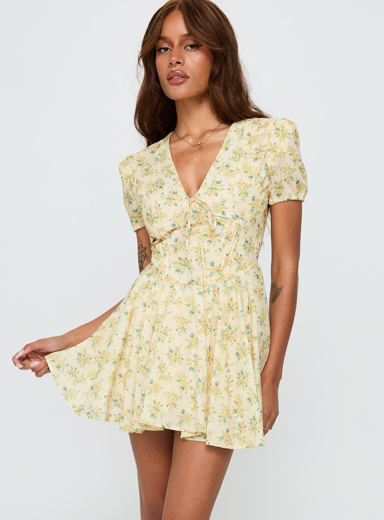 back view of model wearing Princess Polly Ethelyn Mini Dress Yellow Floral V-Neck 