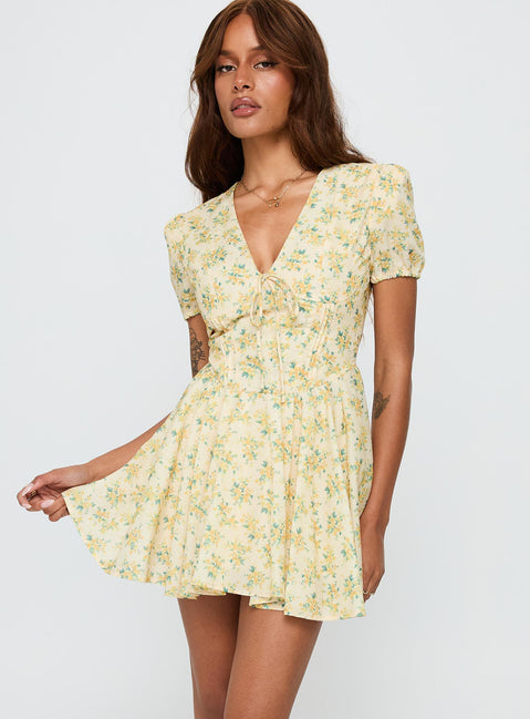 back view of model wearing Princess Polly Ethelyn Mini Dress Yellow Floral V-Neck 