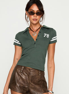front view of model wearing Princess Polly Polo 78 Top Green Short Sleeves V-Neck 