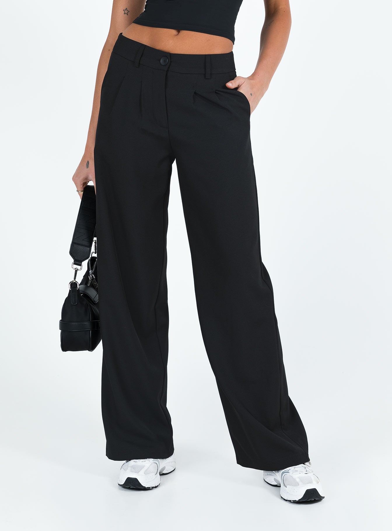 front view of model wearing Princess Polly Archie Low Rise Pants Black Petite Mid Rise 
