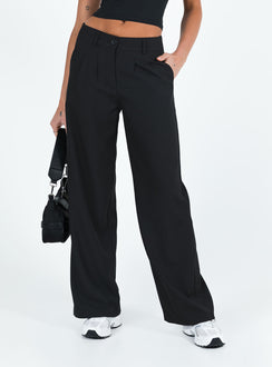 front view of model wearing Princess Polly Archie Low Rise Pants Black Tall Mid Rise 