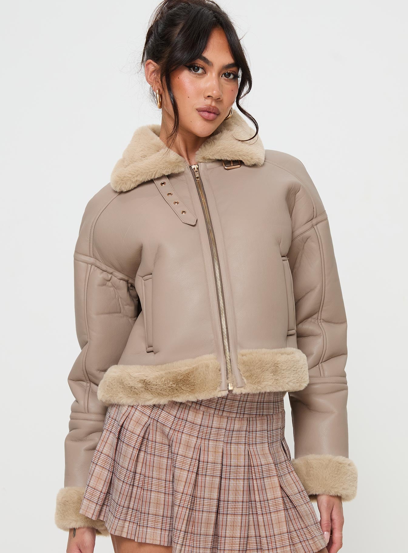 Beige Faux leather jacket Gold toned hardware, zip fastening down front, buckle fastening at neck, twin hip pockets