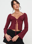 Burgundy Long sleeve top Halterneck style, v neckline, tie closure at front, split hem Good stretch, partially lined 