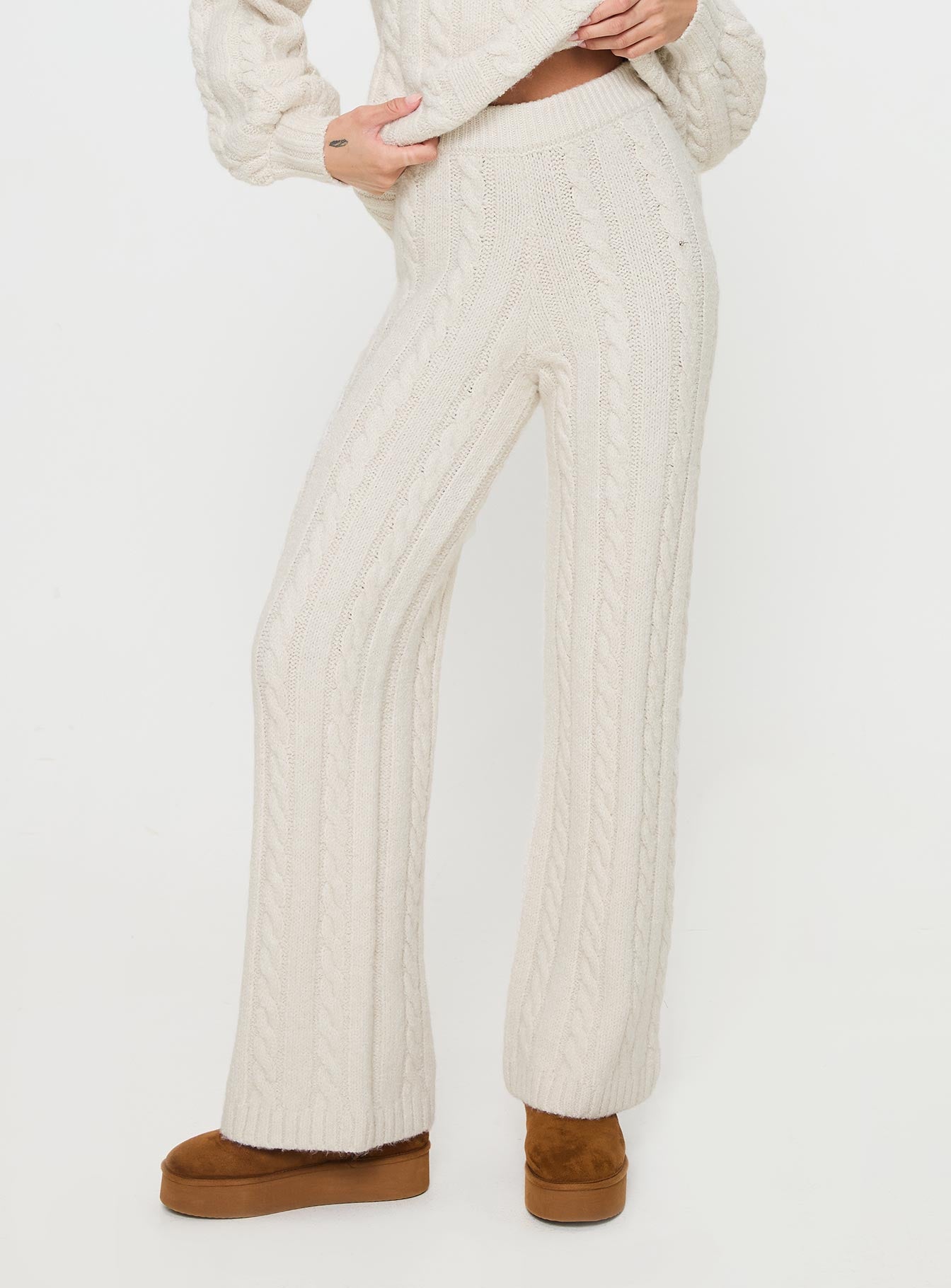 back view of model wearing Princess Polly Sharif Cable Knit Pants Beige High Waisted Pants 