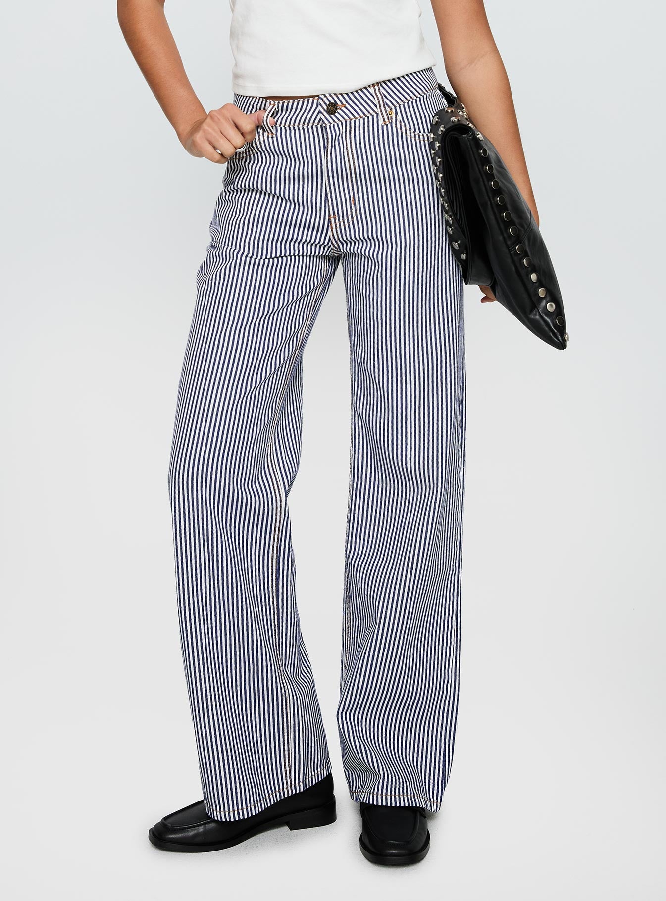 side view of model wearing Princess Polly Top Model Jean Navy Stripe Low Rise Pants 