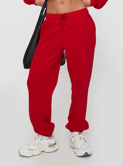 back view of model wearing Princess Polly Dream Fleece Ankle Cuff Sweatpants Red High Waisted Pants 