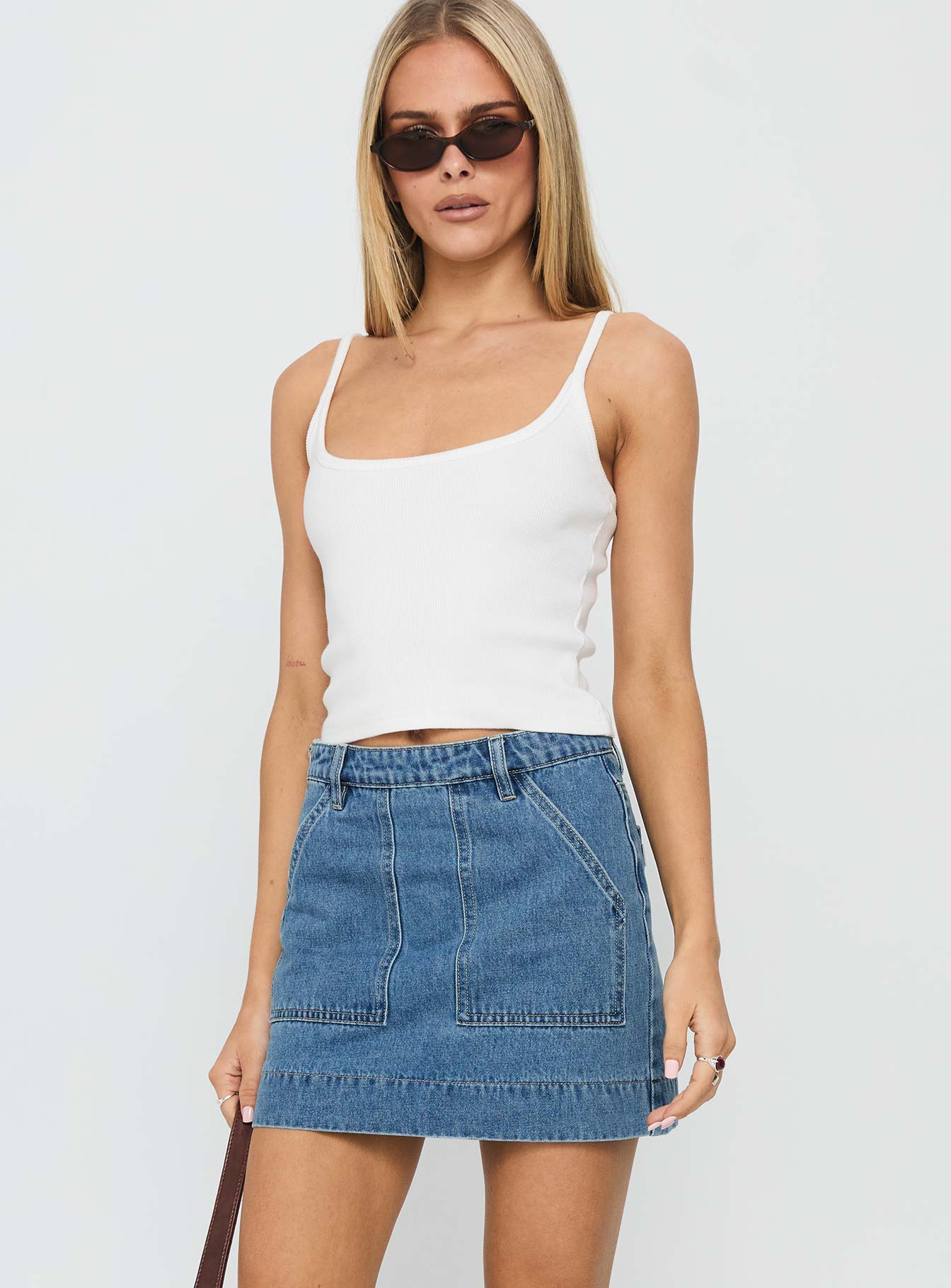 back view of model wearing Princess Polly Hughes Mini Skirt Light Blue Denim Mini Skirts 