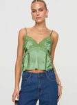 Silky top V neckline, adjustable straps, lace trim detail, split hem at sides with tie Non-stretch material, lined bust