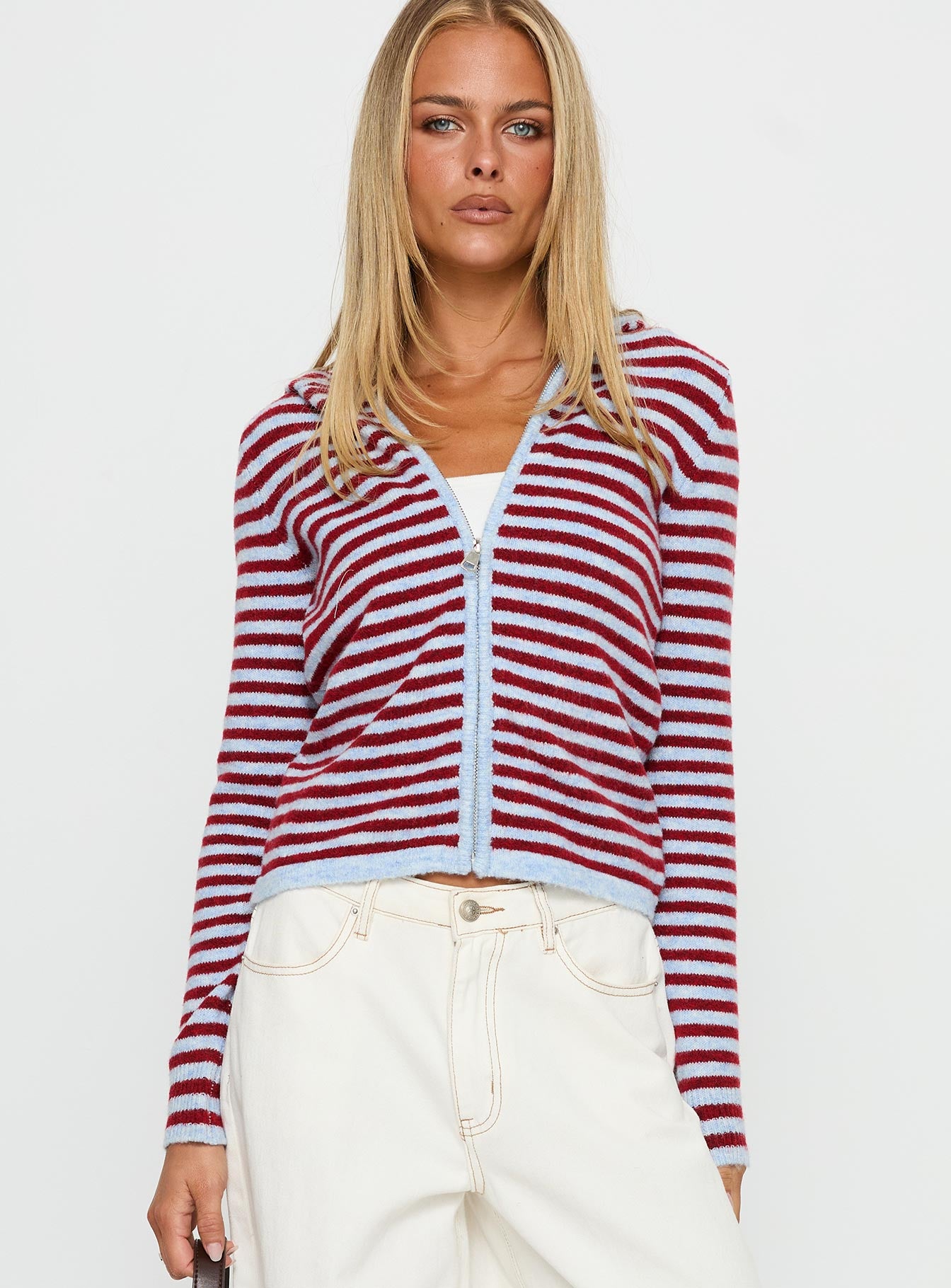 side view of model wearing Princess Polly Superstars Zip Through Hoodie Blue / Red Stripe cropped 