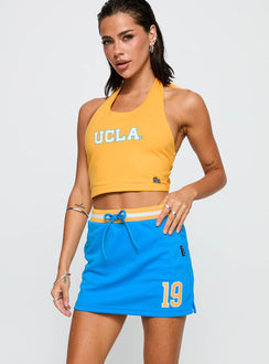 front view of model wearing Princess Polly UCLA Basketball Skirt Blue High Waisted Shorts 