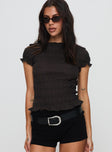 front view of model wearing Princess Polly Romelle Shirred Top Black / Brown Plaid Short Sleeves High Neck 