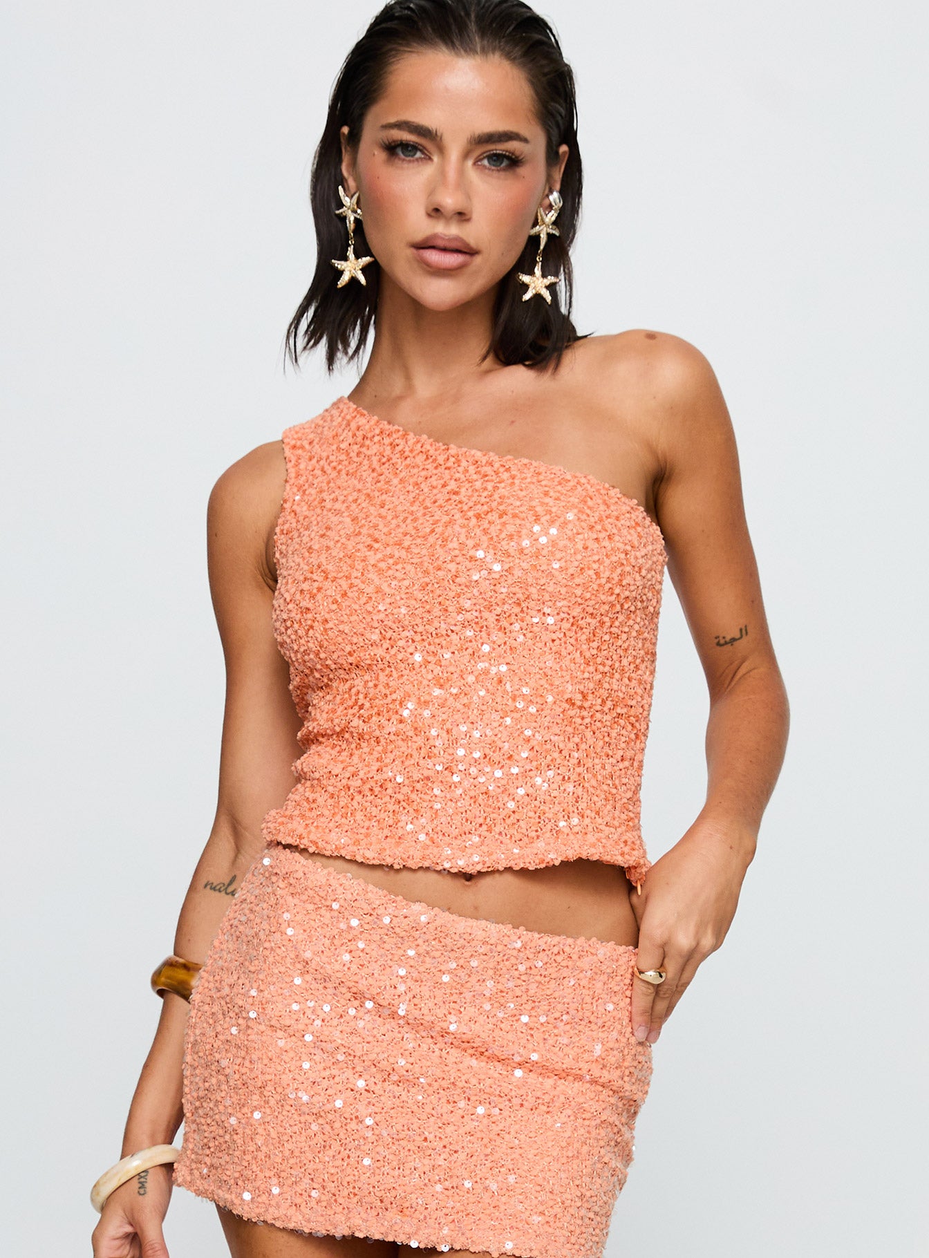 front view of model wearing Princess Polly Zaraya Sequin One Shoulder Top Orange Sleeveless Asymmetric Neckline 
