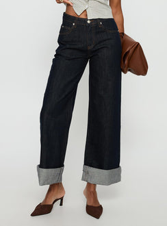 back view of model wearing Princess Polly Squire Mid Rise Straight Leg Folded Hem Jeans Indigo Wash Mid Rise Jeans 