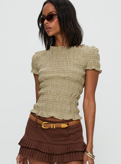 side view of model wearing Princess Polly Romelle Shirred Top Green / Brown Plaid Short Sleeves Crew Neck 