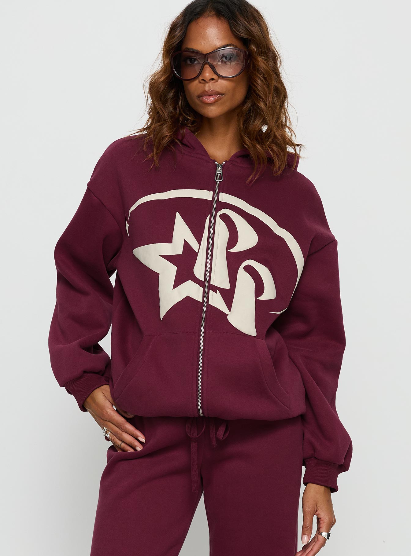 front view of model wearing Princess Polly Princess Polly Stargirl Zip Through Jumper Burgundy 