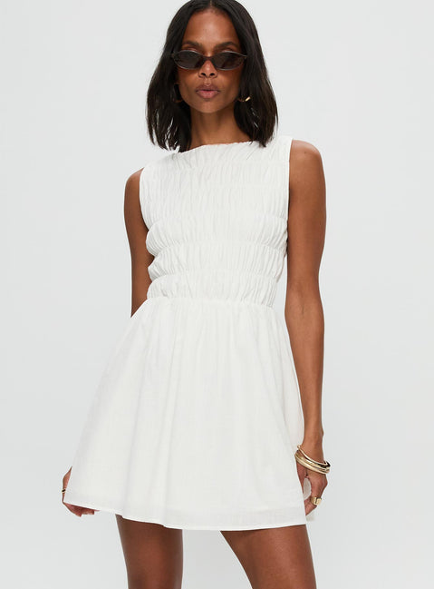 back view of model wearing Princess Polly Melona Shirred Mini Dress White Boat Neck 