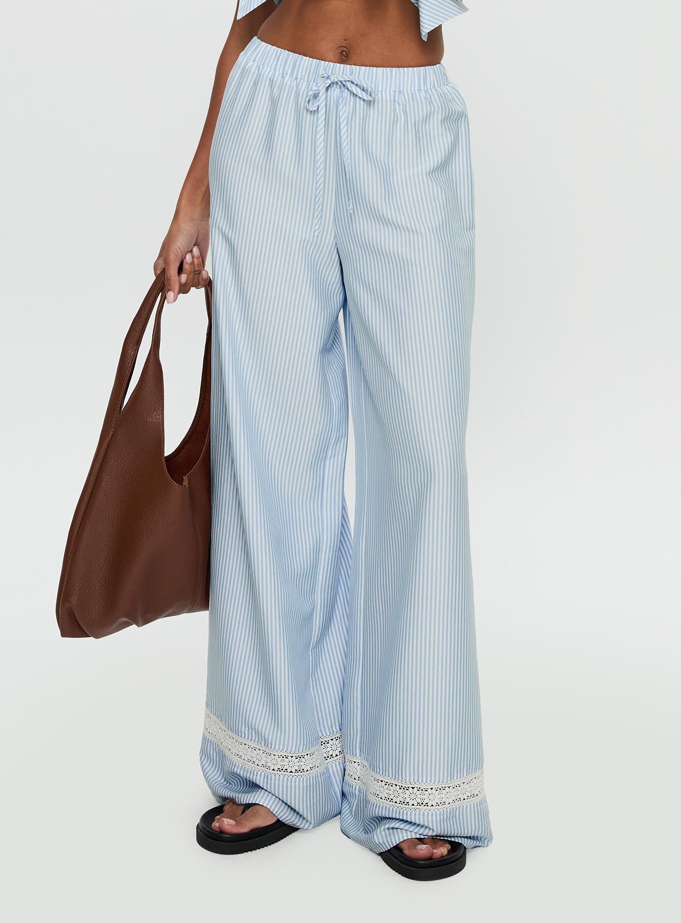 side view of model wearing Princess Polly Summer Too Hot Pant Blue Stripe High Waisted Pants 