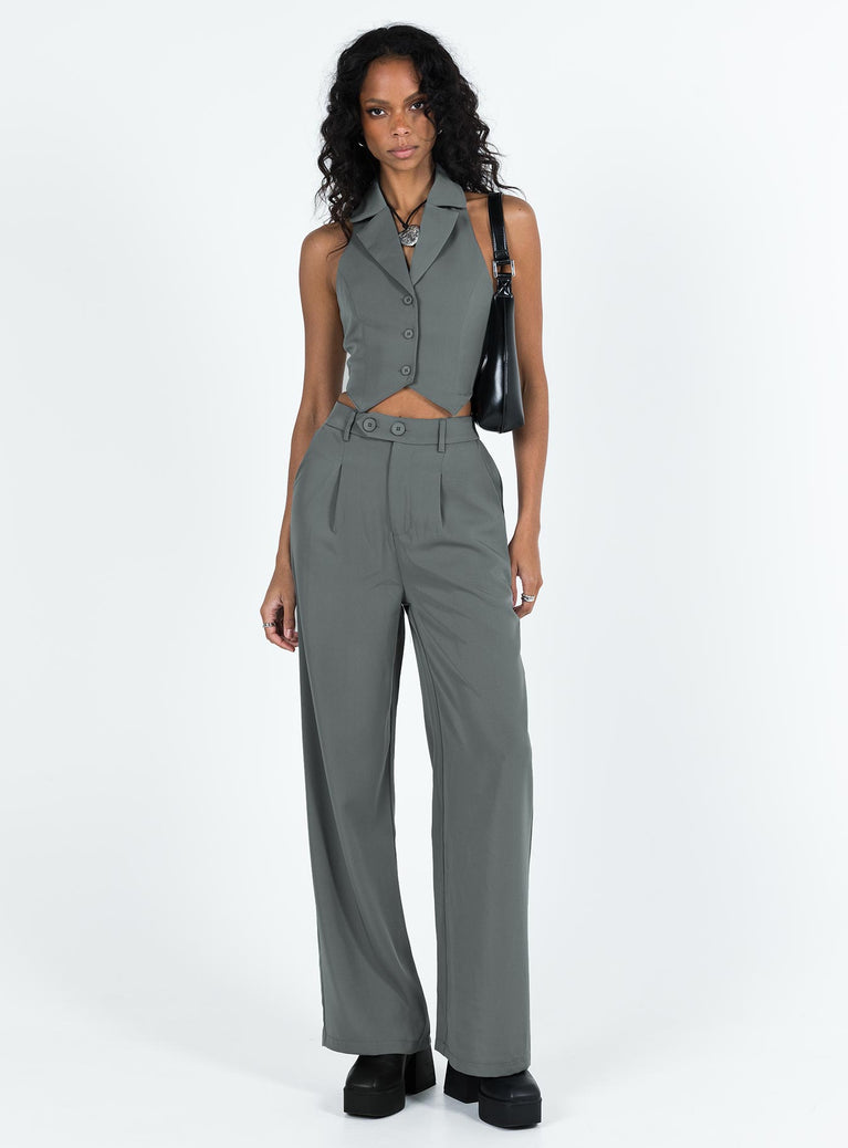 Matching set Vest top  Lapel collar  Button front fastening  High waisted pants  Zip and button fastening  Belt looped waist  Twin hip pockets  Elasticated back Wide leg 