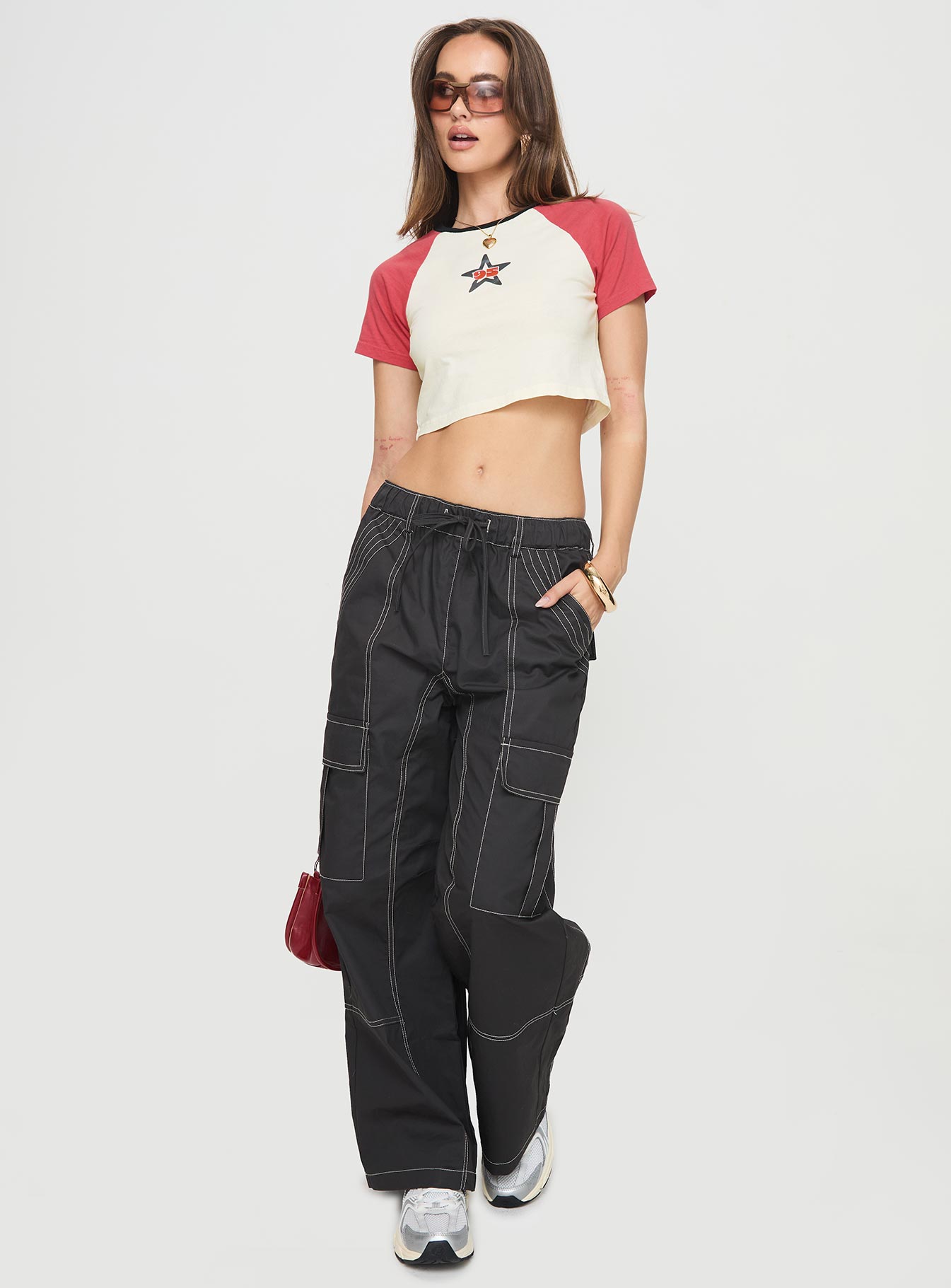 front view of model wearing Princess Polly Soria Cargo Pants Black Low Rise Pants 
