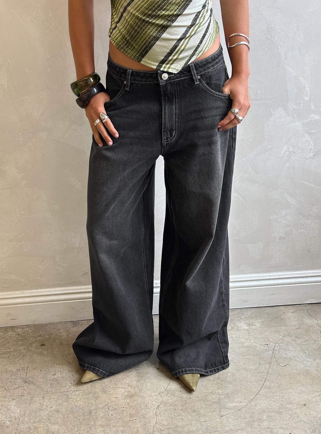 back view of model wearing Princess Polly Naylor Wide Leg Jeans Grey Wash Low Rise Jeans 