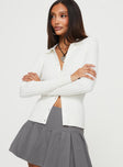 White Top  Long sleeves, classic collar, knit like material  Button fastening at front 