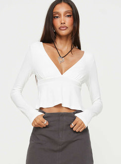 Front view of model wearing  front Princess Polly Full Sleeves V-Neck  Segarra Long Sleeve Top White