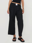 front view of model wearing Princess Polly Beach House Pants Black Low Rise Pants 