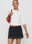   front view of model wearing Princess Polly Dapple Bias Mini Skirt Black Polka Dot Mini Skirts 