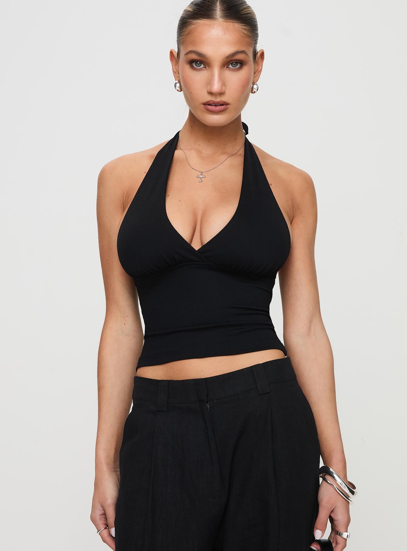 front view of model wearing Princess Polly Whimsy Halter Top Black Sleeveless Plunger 