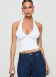 front view of model wearing Princess Polly Whimsy Halter Top White Sleeveless Plunger 